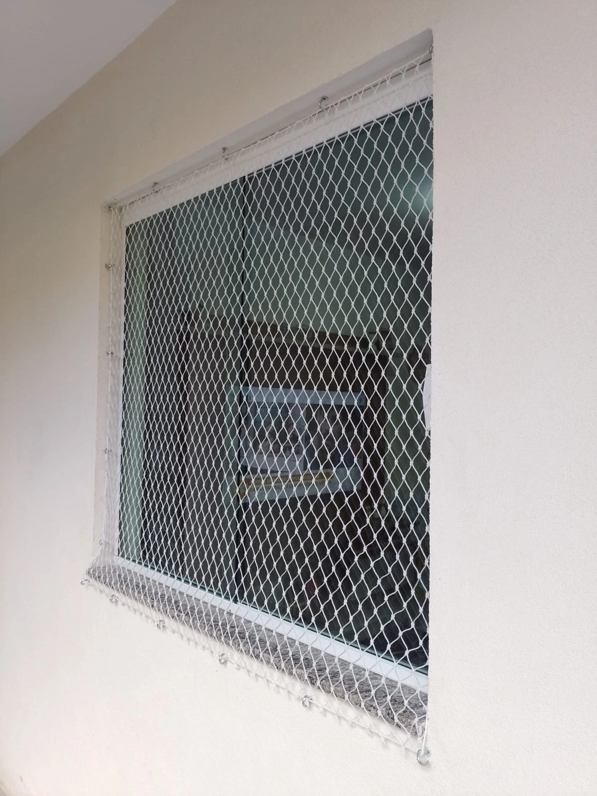 Rede de proteção para pets e crianças em janela